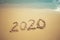 Happy New Year 2020 concept, 2020 number lettering on the sea beach.