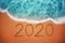 Happy New Year 2020 concept on the sea beach; sunrsie shot