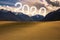 Happy New Year 2020 number behind a mountain and sunset light.