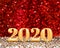 Happy new year 2020 year number  3d rendering  at sparkling gold and red glitter studio background ,Holiday Greeting card.copy