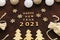 Happy new year 2021 on the chocolate background in a handmade style