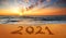 Happy New Year 2021! Written 2021 on the beach. Happy New Year 2021 is coming concept sandy