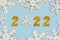 Happy new year 2022. Golden Numbers 2022 with snowflakes.New Years Eve celebration concept background