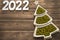 Happy New Year 2022. New Year\\\'s green peas in saucers in the form of a Christmas tree. with white numbers 2022