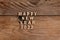 Happy New Year 2022. Quote made from wooden letters and numbers 2022 on wooden background. Creative concept for new year greeting