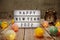 Happy New Year 2022 text on lightbox on wooden background