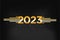 Happy New Year 2023 with Gold gradient numbers with sparkling stars and lights on a black background