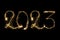 Happy New Year 2023. Number 2023 written sparkling sparklers