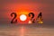 Happy New Year 2024 concept image with text over sea .