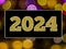 Happy New Year 2024 Shiny Golden Glitter Text On Golden Bokeh Light.