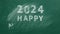 HAPPY NEW YEAR 2024 written in chalk on a greenboard