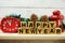 Happy new year alphabet letters on wooden background