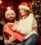 Happy new year. Bearded man and woman. Christmas time. Lovely married couple cuddle christmas tree background. Happiness