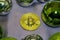 Happy New year Bitcoin trinket with Golden ribbon on wooden green background. Selective focus.