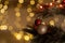 Happy New Year and Christmas background, tree decorate with gold ball on branch with bokeh of defocused garlands. Cozy