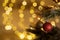 Happy New Year and Christmas background, tree decorate with red ball on branch with bokeh of defocused garlands. Cozy