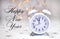 Happy New Year message with white retro clock with sample text