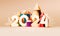 Happy New year poster 2024. White numbers with gift boxes and Christmas tree. Bright greeting card design