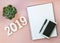 Happy New Year\'s FLAT LAY 2019 notepad, free space for text. Christmas decorations. Goals for the new year. mockup phone