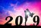 Happy new year Silhouette sunset background.Man standing and lift woman.