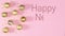 Happy New year text appear next to gold Christmas ornaments on pastel pink theme. Stop motion