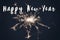 happy new year text sign, burning sparkler firework bengal light. space for text. burning