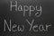 Happy New Year written on a school blackboard.