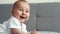 Happy newborn baby smiling closeup