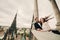 Happy newlywed. beautiful bride and stylish groom are having fun on the balcony of old gothic cathedral with panoramic city views