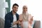 Happy News. Cheerful Pregnant Muslim Couple Talking At Camera, Making Pregnancy Announcement