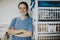 Happy nurse in a medical supplies room