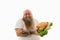 A happy obese bearded man with tattooed arms holds a huge burger and smiles with closed eyes. Unhealthy food concept