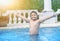 Happy obese fat boy in swimming pool,