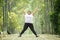 Happy obese woman jumps on the road