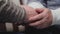 Happy old couple holding hands. Beautiful Semnygy shots. Close-up of the hands of lovely elderly couple caring and