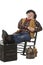 Happy old cowboy in rocking chair with feet up