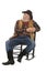 Happy old cowboy sits in rocking chair