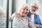 Happy old man and woman bursting with laugh