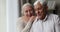 Happy older married couple have fun together chat feel connection