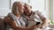 Happy older wife and husband cuddling, using phone together