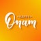 Happy Onam greeting lettering. Ink typography phrase for Indian festival. Black text on festive orange