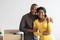 Happy Owners. Cheerful Black Spouses Posing With Keys From Their New Home