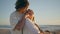 Happy pair dating ocean beach sundown closeup. Romantic teen couple embracing
