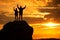 Happy pair silhouettes over sea and mountains