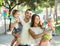 Happy parents with children playing windmills