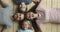 Happy parents and kids lying on warm wooden floor, portrait