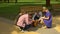 Happy parents and their children stroking beautiful dog in park, pet adoption