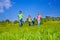 Happy parents walk with boys in park