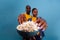 Happy partners holding glass bowl with popcorn and eating snack