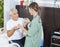 Happy Patient Receiving Medicine And Water Glass From Nurse